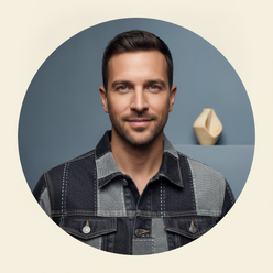 Circular portrait of a confident man, Sam Carter, with short dark hair and stubble, wearing a dark wash denim jacket.